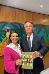 Presidente Jair Bolsonaro recebe o livro Candelária de presente da Deputada...